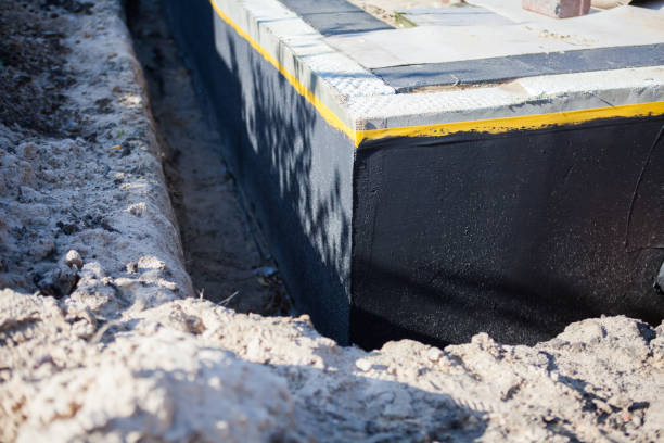 Professional Basement Waterproofing technician working in Snellville, GA